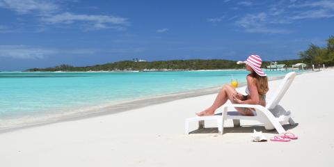 Woman sitting on beach in Exumas