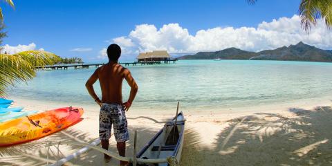 Man and canoe in Tahiti