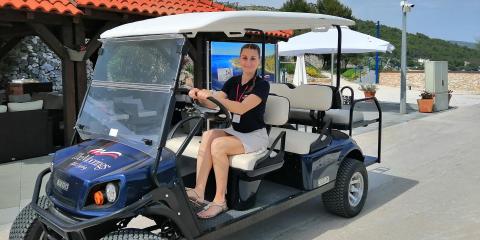 Woman in golf buggy